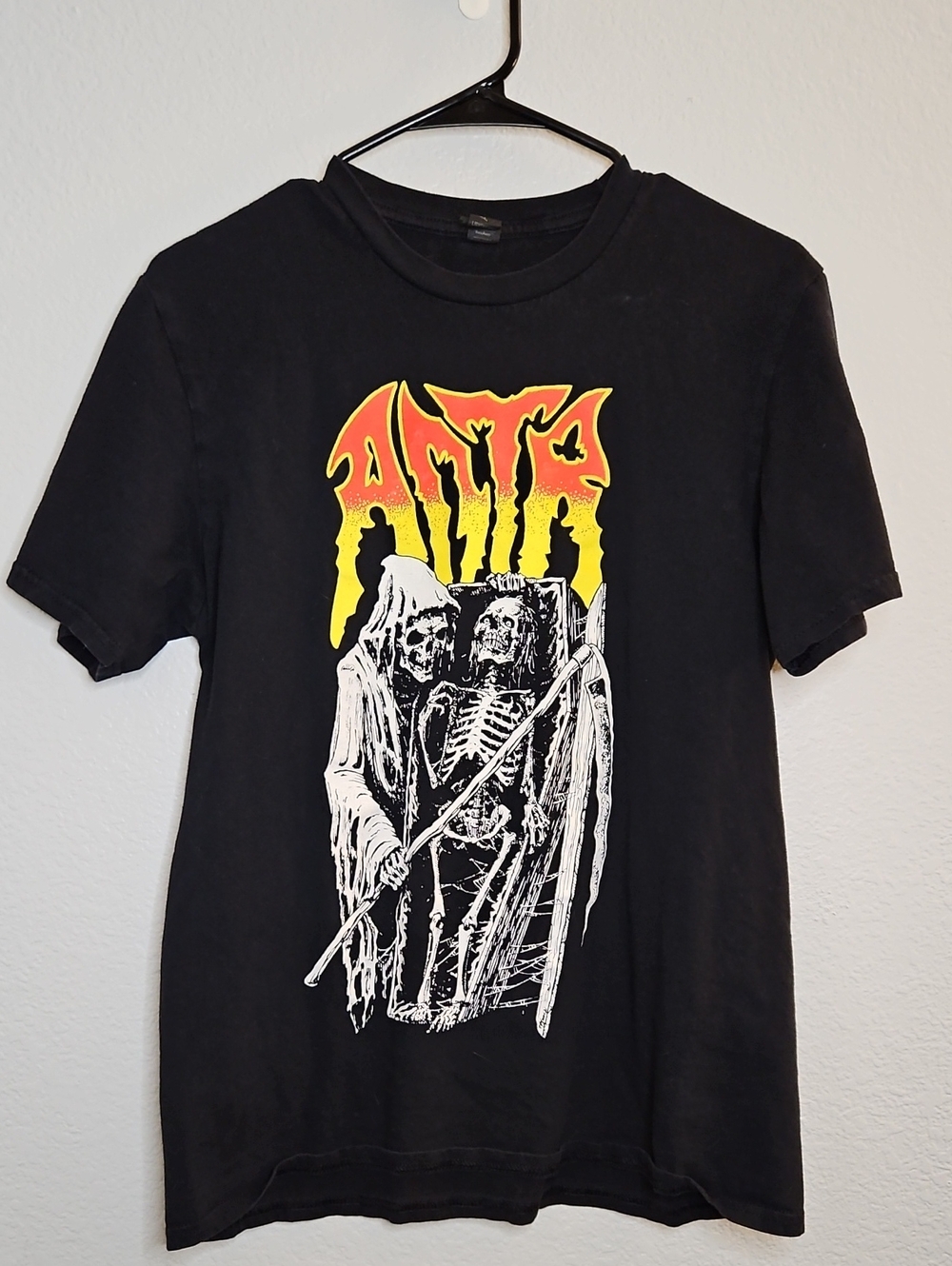 Anvil Black Tee with Yellow-Orange Band Logo and White Skeleton Graphic